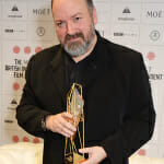 Dave McKean, winner of The Raindance Award for Luna, poses at The Moet British Independent Film Awards 2014 at Old Billingsgate Market on December 7, 2014 in London, England. (Photo by David M. Benett/Getty Images for The Moet British Independent Film Awards) Dave McKean