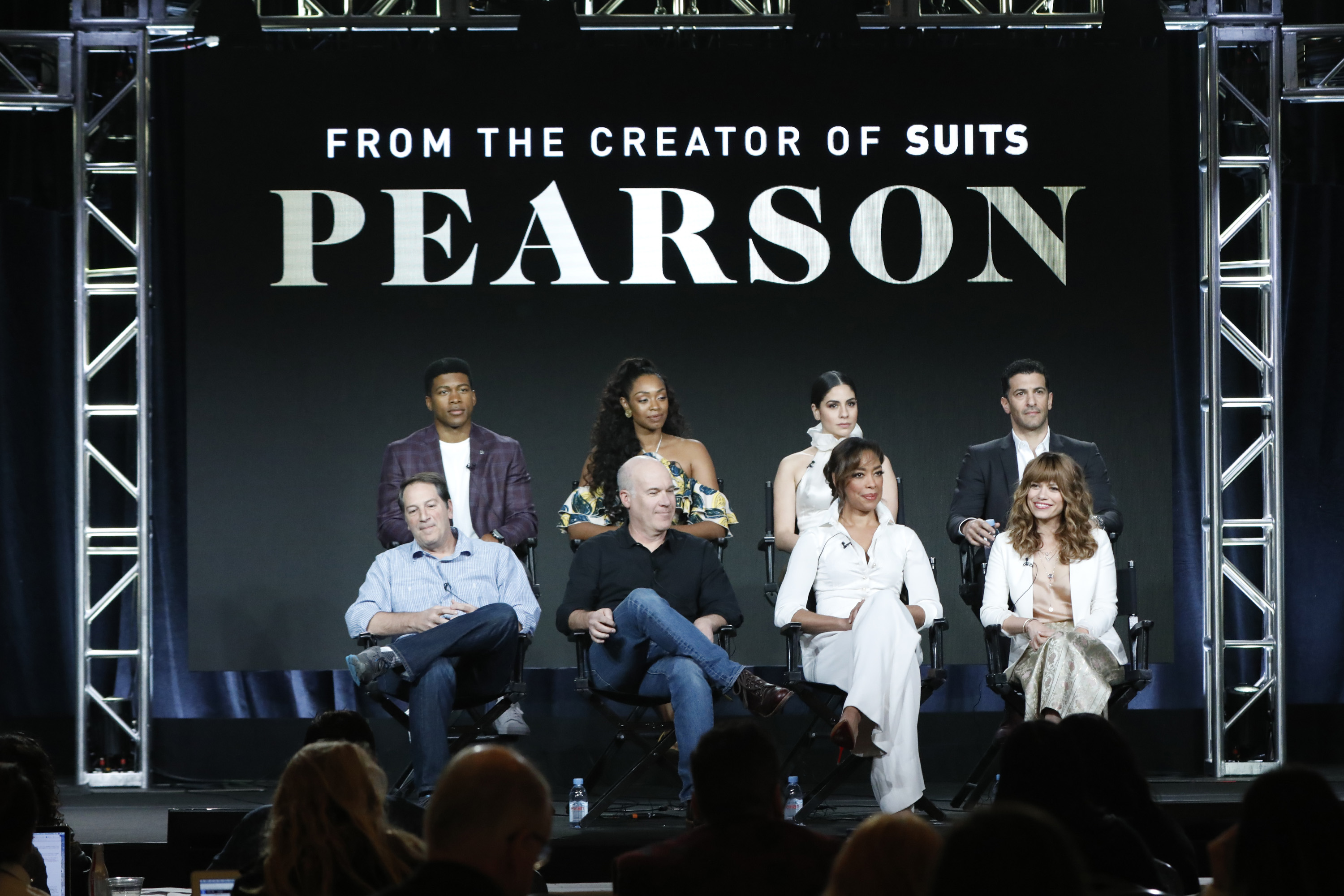 NBCUNIVERSAL EVENTS -- NBCUniversal Press Tour, January 2019 -- USA Network's "Pearson" Panel -- Pictured: (l-r) Eli Goree; Chantel Riley; Isabel Arraiza; Simon Kassianides; Aaron Korsh, Executive Producer; Daniel Arkin, Executive Producer & Showrunner; Gina Torres, Co-Executive Producer; Bethany Joy Lenz, USA Network's "Pearson" -- (Photo by: Evans Vestal Ward/NBCUniversal)